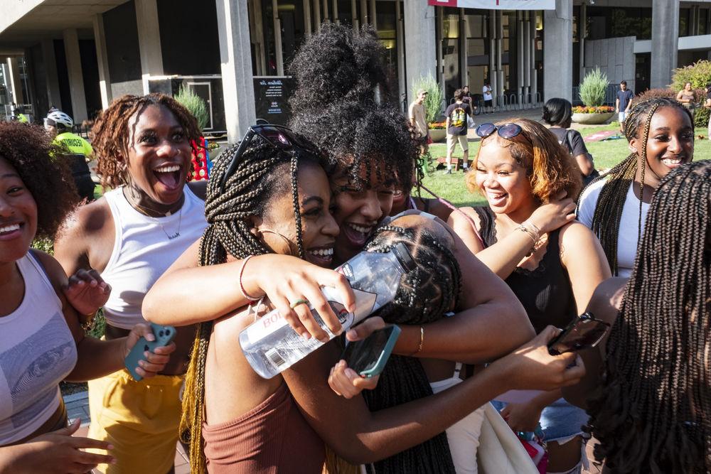 A group of students hugging each during Temple Fest.